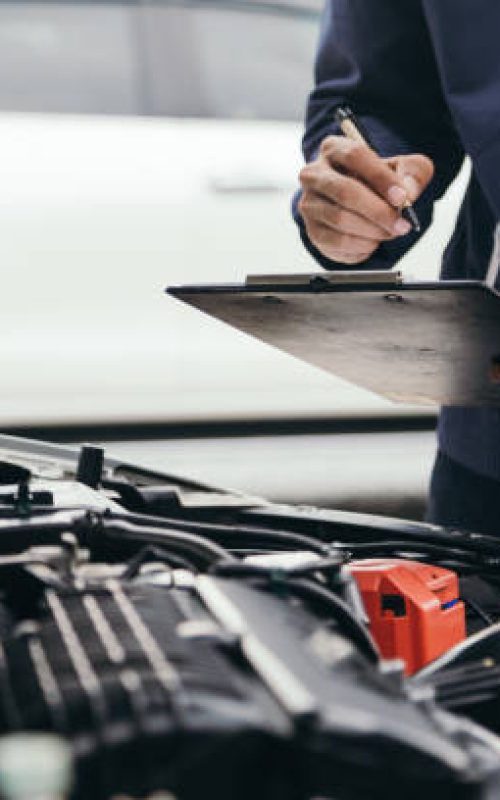 Automobile mechanic repairman hands repairing a car engine automotive workshop with a wrench, car service and maintenance,Repair service.